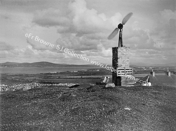 HOME-MADE WINDCHARGER (OLD AEROPLANE PROPELLOR) ERECTED BY FR. P.KILGALLON P.P.